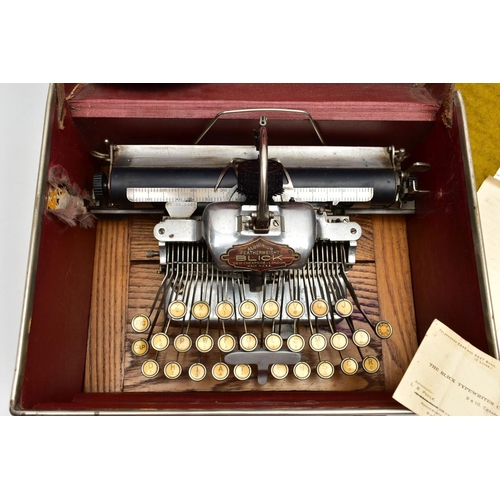 196 - AN EARLY 20TH CENTURY BLICK ALUMINIUM FEATHERWEIGHT TYPEWRITER IN A TAN LEATHER COVERED CASE, the re... 