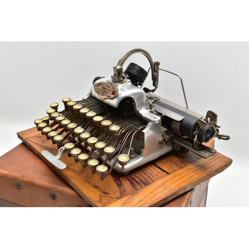 196 - AN EARLY 20TH CENTURY BLICK ALUMINIUM FEATHERWEIGHT TYPEWRITER IN A TAN LEATHER COVERED CASE, the re... 