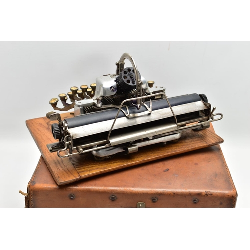 196 - AN EARLY 20TH CENTURY BLICK ALUMINIUM FEATHERWEIGHT TYPEWRITER IN A TAN LEATHER COVERED CASE, the re... 