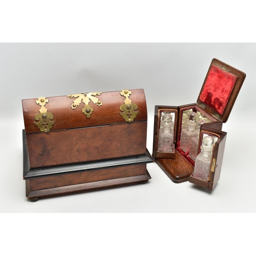 220 - A VICTORIAN BRASS MOUNTED WALNUT AND EBONISED DESKSTAND, fitted with an arched stationery box, two g... 