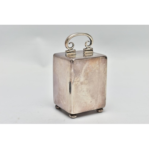 23 - AN EDWARDIAN WILLIAM COMYNS MINIATURE SILVER BOUDOIR CLOCK, the plain case with swing carrying handl... 