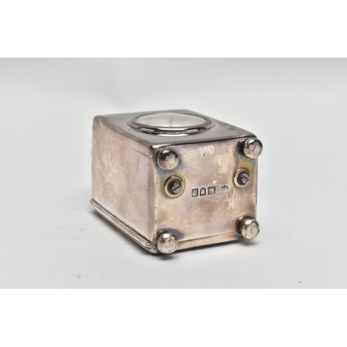 23 - AN EDWARDIAN WILLIAM COMYNS MINIATURE SILVER BOUDOIR CLOCK, the plain case with swing carrying handl... 