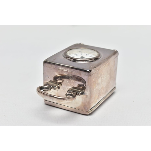 23 - AN EDWARDIAN WILLIAM COMYNS MINIATURE SILVER BOUDOIR CLOCK, the plain case with swing carrying handl... 