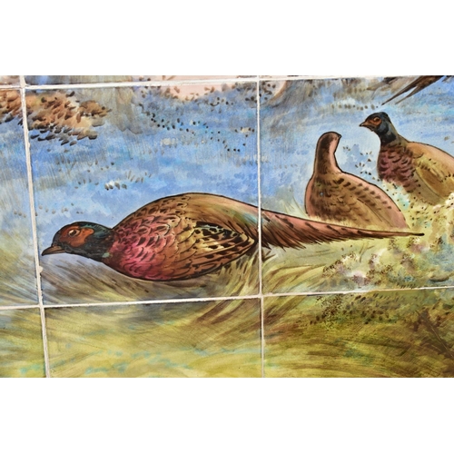 238A - AN EARLY 20TH CENTURY FORTY TWO TILE PANEL HAND PAINTED WITH COCK AND HEN PHEASANTS IN  A WOODLAND C... 