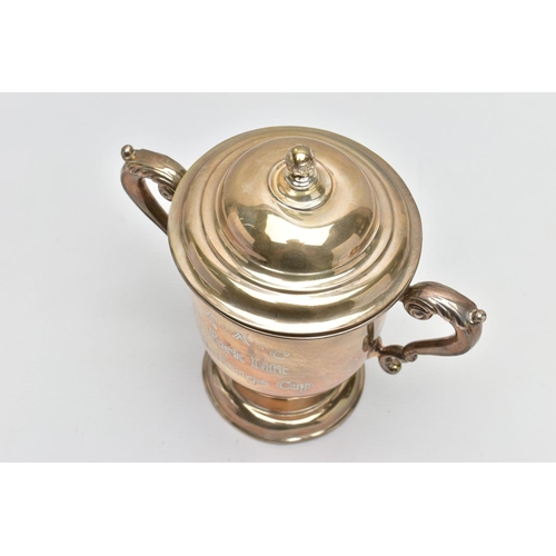 24 - A GEORGE V SILVER TWIN HANDLED TROPHY CUP AND COVER, the pull off domed cover with foliate ball fini... 