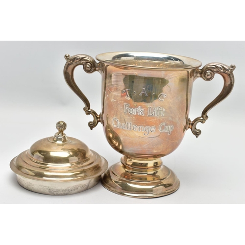 24 - A GEORGE V SILVER TWIN HANDLED TROPHY CUP AND COVER, the pull off domed cover with foliate ball fini... 