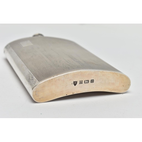 26 - AN ELIZABETH II SILVER HIP FLASK OF BOWED RECTANGULAR FORM, fitted with a hinged bayonet cap with co... 