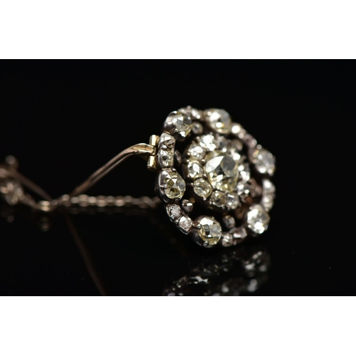 3 - A GEORGIAN DIAMOND CLUSTER BROOCH, set with a principal old European cut diamond, measuring approxim... 