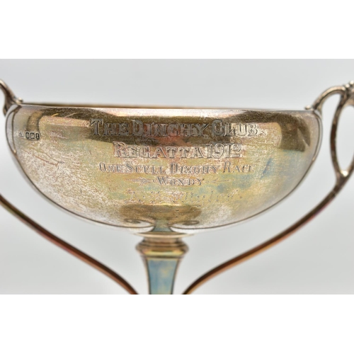 45 - A GEORGE V SILVER TWIN HANDLED TROPHY CUP, the shallow silver cup on a slender pedestal with cast sc... 