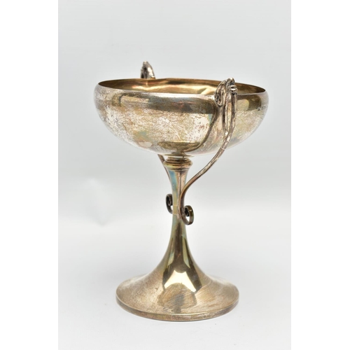 45 - A GEORGE V SILVER TWIN HANDLED TROPHY CUP, the shallow silver cup on a slender pedestal with cast sc... 