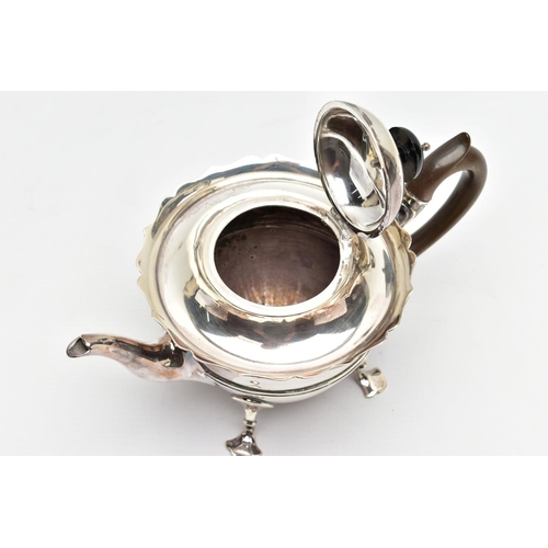 50 - AN EARLY 20TH CENTURY SILVER TEAPOT AND A SET OF SIX GEORGE V SILVER COFFEE SPOONS IN AN UNASSOCIATE... 