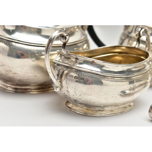 54 - A GEORGE V SILVER FOUR PIECE TEA SERVICE OF OVAL FORM, comprising tea pot, hot water/coffee jug, mil... 