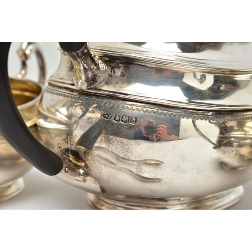 54 - A GEORGE V SILVER FOUR PIECE TEA SERVICE OF OVAL FORM, comprising tea pot, hot water/coffee jug, mil... 