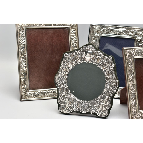 56 - SEVEN MODERN SILVER EASEL BACK PHOTOGRAPH FRAMES, comprising four matching frames of rectangular for... 