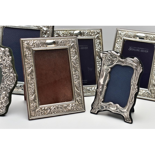 56 - SEVEN MODERN SILVER EASEL BACK PHOTOGRAPH FRAMES, comprising four matching frames of rectangular for... 