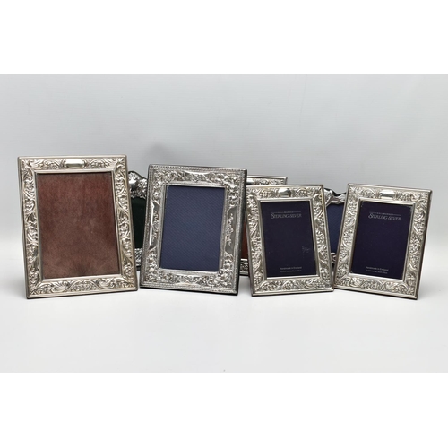 56 - SEVEN MODERN SILVER EASEL BACK PHOTOGRAPH FRAMES, comprising four matching frames of rectangular for... 