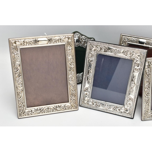 56 - SEVEN MODERN SILVER EASEL BACK PHOTOGRAPH FRAMES, comprising four matching frames of rectangular for... 
