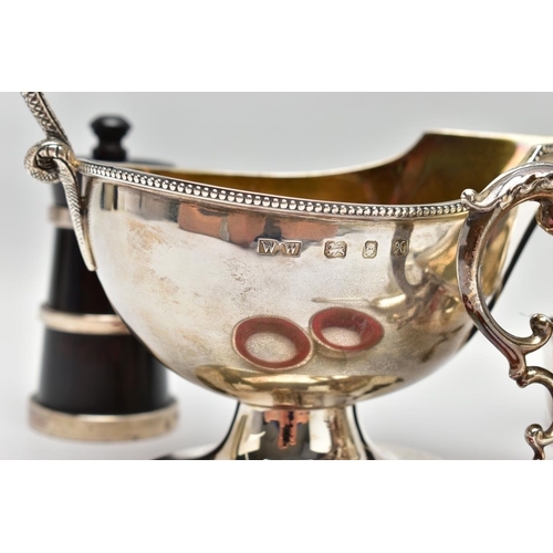 57 - A PAIR OF ELIZABETH II SILVER MOUNTED WOODEN SALT AND PEPPER GRINDERS, AN ELIZABETH II SILVER SAUCE ... 