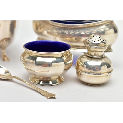 60 - A PAIR OF GEORGE V SILVER NAVETTE SHAPED SALTS, FOUR OTHER SILVER CRUET ITEMS, A GEORGE V SILVER SAU... 