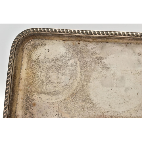 68 - AN EARLY 20TH CENTURY SILVER RECTANGULAR TRAY, gadrooned rim, marks totally illegible due to rubbing... 