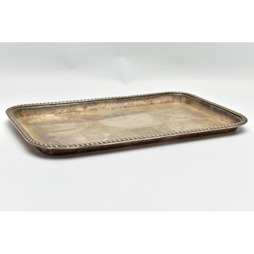 68 - AN EARLY 20TH CENTURY SILVER RECTANGULAR TRAY, gadrooned rim, marks totally illegible due to rubbing... 