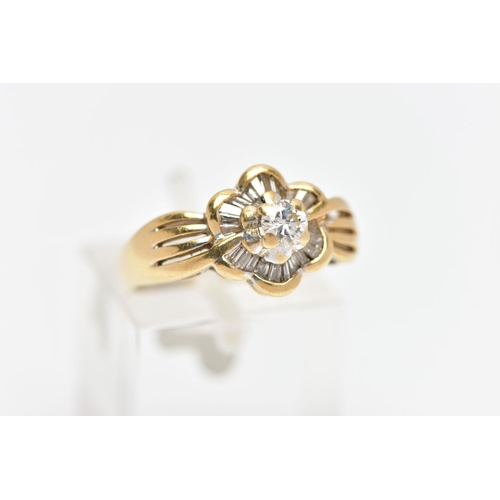 7 - A MODERN YELLOW METAL DIAMOND CLUSTER RING, set with a principal round brilliant cut diamond, within... 