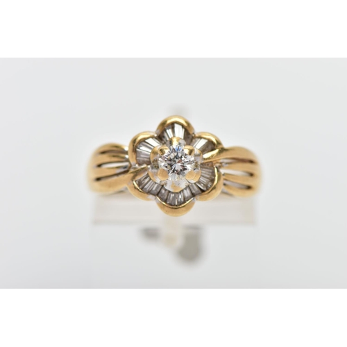 7 - A MODERN YELLOW METAL DIAMOND CLUSTER RING, set with a principal round brilliant cut diamond, within... 