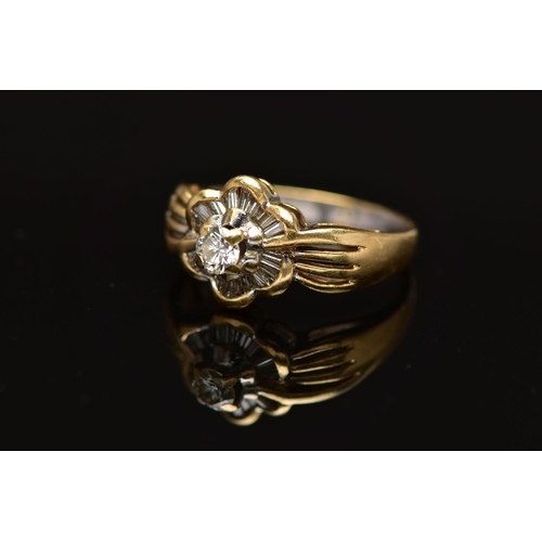 7 - A MODERN YELLOW METAL DIAMOND CLUSTER RING, set with a principal round brilliant cut diamond, within... 