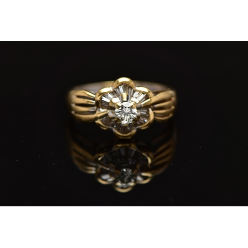 7 - A MODERN YELLOW METAL DIAMOND CLUSTER RING, set with a principal round brilliant cut diamond, within... 