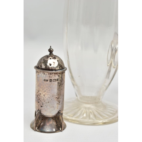 71 - A PAIR OF ARTS & CRAFTS PLANISHED SILVER PEPPERETTES, with domed pull off cover over cylindrical bod... 