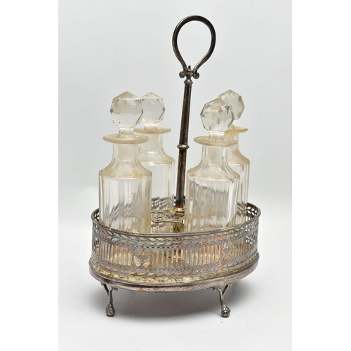 74 - A GEORGE III SILVER OVAL EIGHT BOTTLE CRUET FRAME, with chased and pierced gallery sides, engraved i... 