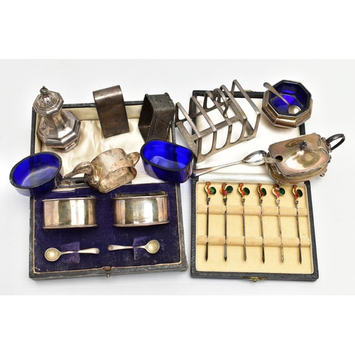75 - A PARCEL OF SILVER CRUET ITEMS, NAPKIN RINGS, TOAST RACK, ETC, including a cased set of six cocktail... 