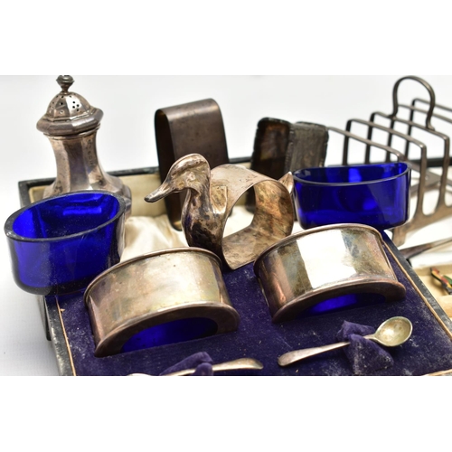 75 - A PARCEL OF SILVER CRUET ITEMS, NAPKIN RINGS, TOAST RACK, ETC, including a cased set of six cocktail... 