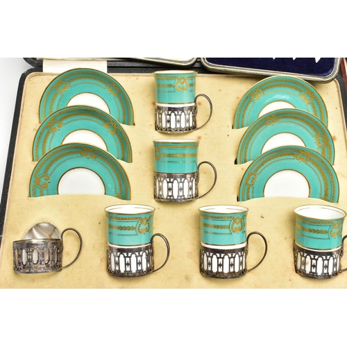 77 - A CASED GEORGE JONES & SONS CRESCENT CHINA TWELVE PIECE COFFEE SET, comprising six silver handled sl... 