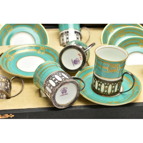 77 - A CASED GEORGE JONES & SONS CRESCENT CHINA TWELVE PIECE COFFEE SET, comprising six silver handled sl... 