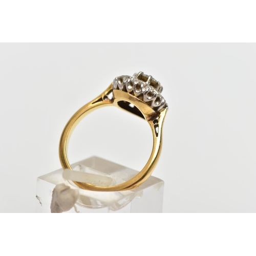 9 - A DIAMOND NINE STONE CLUSTER RING, set with a principal round brilliant cut diamond, surrounded by e... 