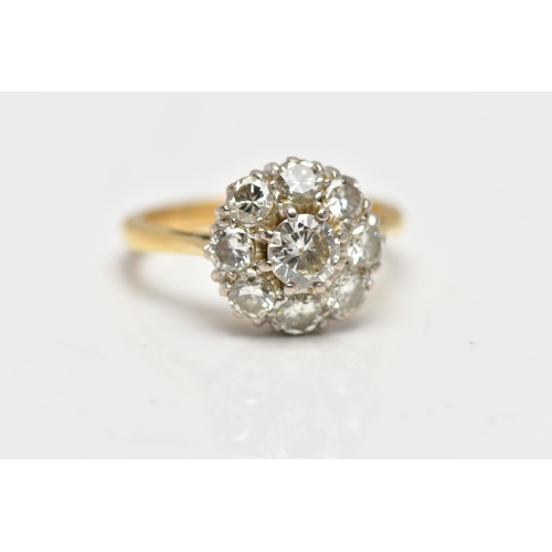 9 - A DIAMOND NINE STONE CLUSTER RING, set with a principal round brilliant cut diamond, surrounded by e... 