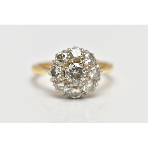 9 - A DIAMOND NINE STONE CLUSTER RING, set with a principal round brilliant cut diamond, surrounded by e... 