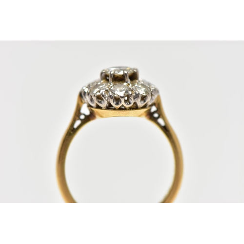 9 - A DIAMOND NINE STONE CLUSTER RING, set with a principal round brilliant cut diamond, surrounded by e... 