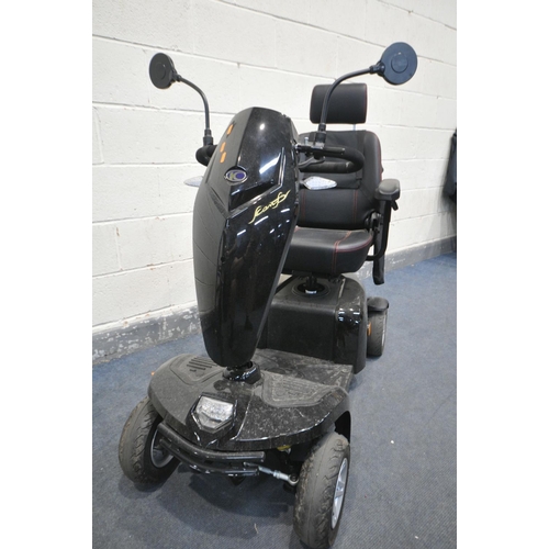 1007 - A KOMFY 4 MOBILITY SCOOTER, in a black finish, complete with key, charger, manual, and sales receipt... 