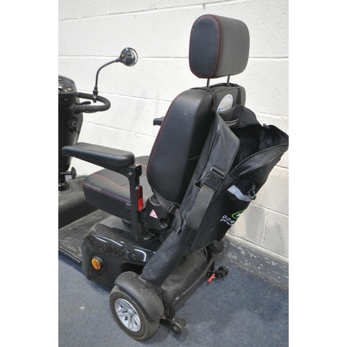 1007 - A KOMFY 4 MOBILITY SCOOTER, in a black finish, complete with key, charger, manual, and sales receipt... 