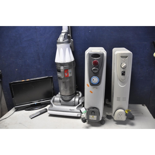 1053 - A DYSON DC07 VACUUM along with two oil filled electric heaters and a Techwood 19884hddvd 19in tv wit... 