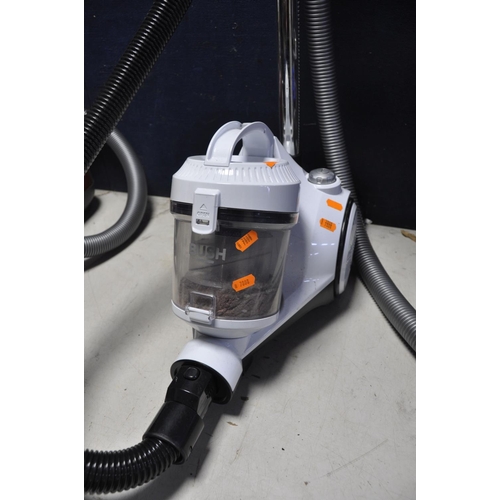 1054 - A DYSON DC24 MULTIFLOOR VACUUM along with a Bush VCS35B15KOD-70 vacuum cleaner and a Miele compact c... 