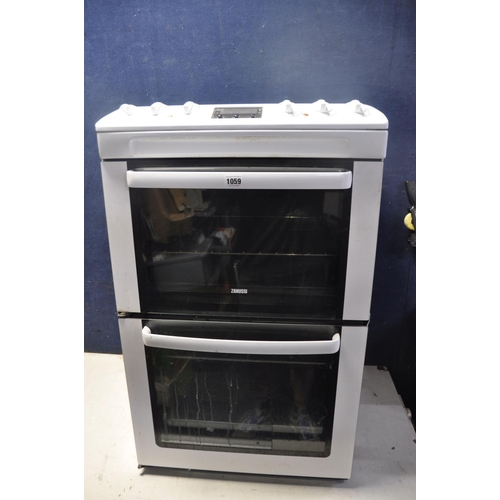 1059 - A ZANUSSI ZCV550MWC ELECTRIC COOKER measuring width 55cm x depth 65cm x height 90cm (UNTESTED)