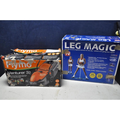 1077 - A FLYMO VENTURER32 LAWNMOWER in original box (UNTESTED) along with a JJB leg magic multi exercise ap... 