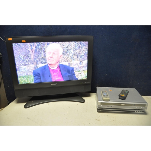 1114 - A SHARP LC-26SD1E 26in TV with remote AND TWO Alba DVD players model Numbers Dvd45 and DS-5711D (all... 