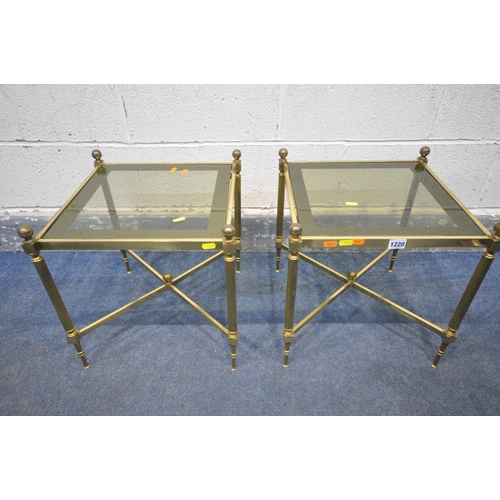 1220 - A PAIR OF MAISON JANSEN STYLE FRENCH BRASS SIDE TABLES, with smoked glass inserts, on Corinthian sup... 