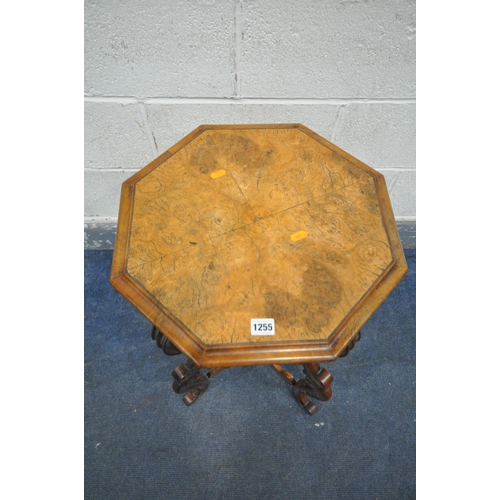 1255 - A 19TH CENTURY BURR WALNUT OCTAGONAL TRUMPET WORK TABLE, the quarter veneer top enclosing a fitted i... 