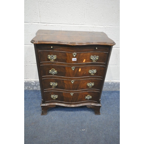 1256 - A REPRODUCTION GEORGE III STYLE MAHOGANY SERPENTINE CHEST OF FOUR LONG DRAWERS, with a brushing slid... 