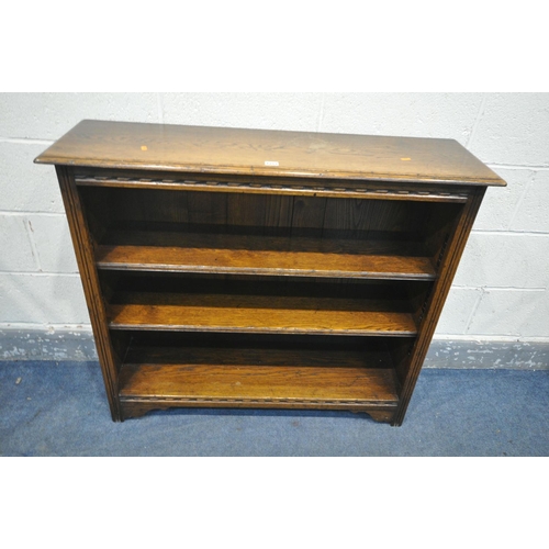 1257 - A SOLID OAK OPEN  BOOKCASE, with two drawers, width 107cm x depth 31cm x height 91cm (condition:-top... 